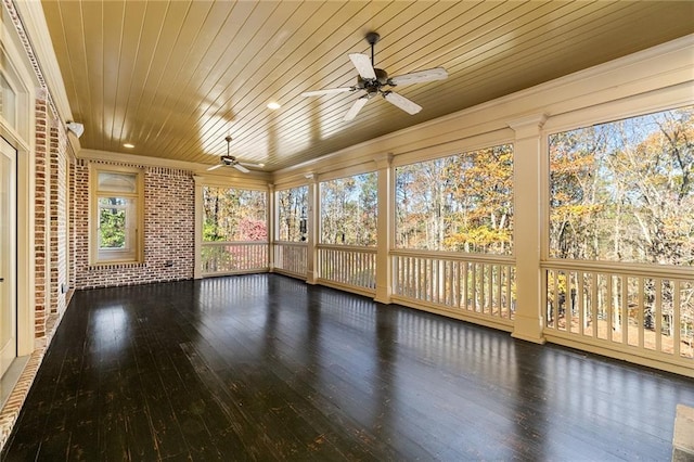 unfurnished sunroom with ceiling fan and wooden ceiling