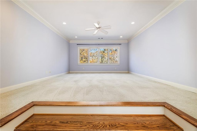 spare room with ceiling fan, carpet, and ornamental molding