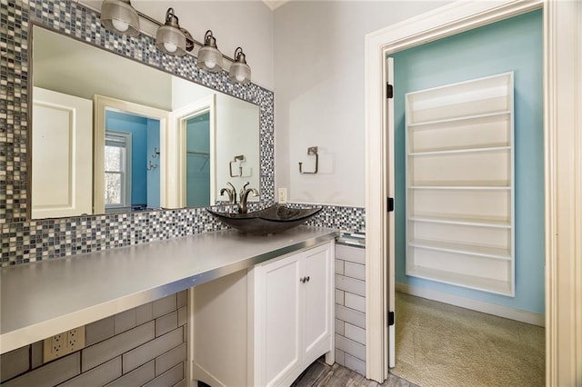 bathroom featuring decorative backsplash and vanity