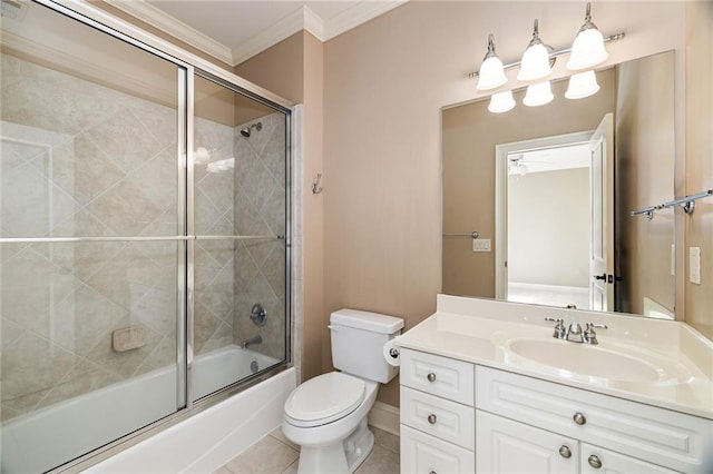 full bathroom featuring combined bath / shower with glass door, tile patterned floors, vanity, crown molding, and toilet