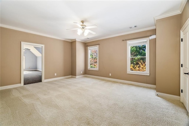 carpeted spare room featuring crown molding and ceiling fan