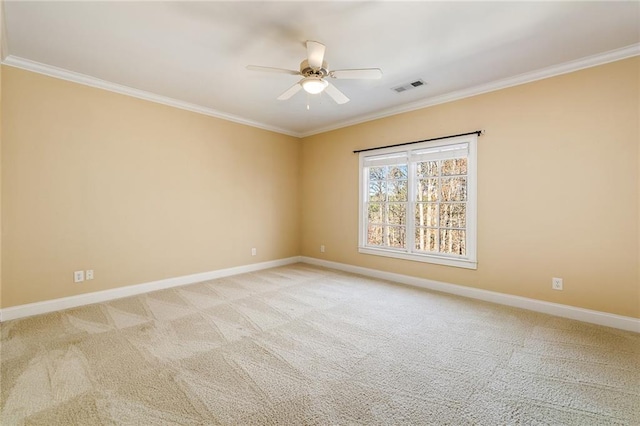 unfurnished room with light carpet, crown molding, and ceiling fan