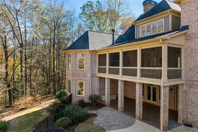 rear view of house with a sunroom