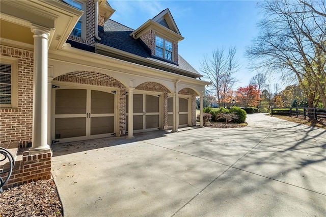 view of side of home featuring a garage