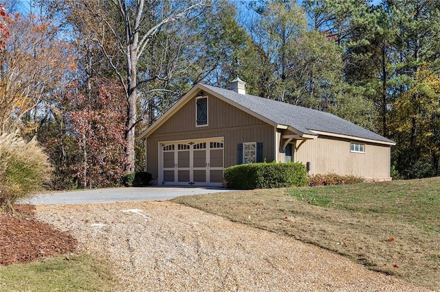 exterior space with a front yard and a garage