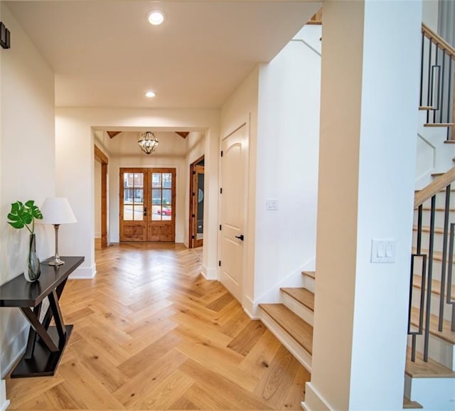 foyer entrance with stairway, recessed lighting, and baseboards