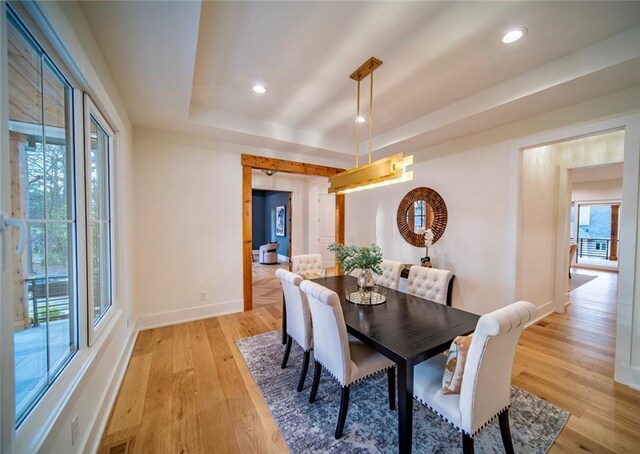 dining area featuring light wood-style flooring, recessed lighting, and baseboards