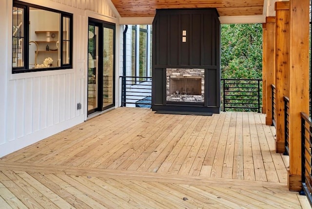 wooden deck featuring a fireplace