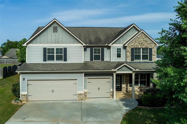 9120 Alden Dr, Locust Grove, GA 30248 - view of front of property featuring board and batten siding, a garage, driveway, and covered porch