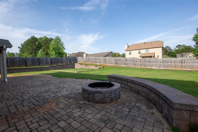 9120 Alden Dr, Locust Grove, GA 30248 - view of patio with an outdoor fire pit