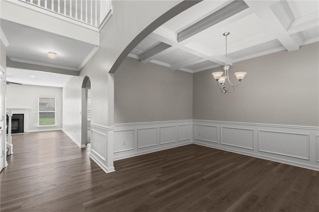 9120 Alden Dr, Locust Grove, GA 30248 - unfurnished dining area with beamed ceiling, arched walkways, dark wood-type flooring, a chandelier, and ornamental molding