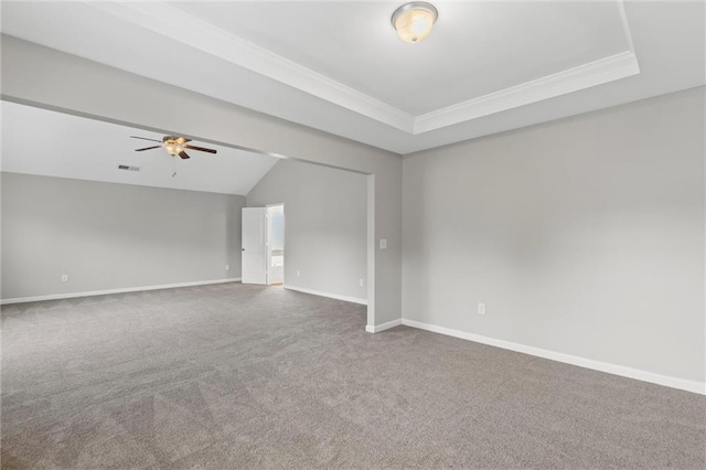 9120 Alden Dr, Locust Grove, GA 30248 - carpeted spare room featuring crown molding, ceiling fan, baseboards, vaulted ceiling, and a raised ceiling
