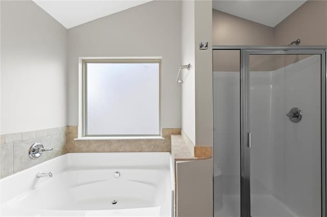 9120 Alden Dr, Locust Grove, GA 30248 - full bath with vaulted ceiling, a stall shower, and a garden tub