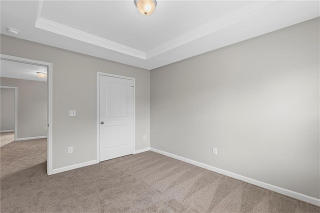 9120 Alden Dr, Locust Grove, GA 30248 - unfurnished bedroom featuring carpet floors, a raised ceiling, baseboards, and crown molding