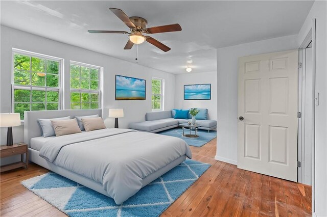bedroom featuring a ceiling fan and hardwood / wood-style floors