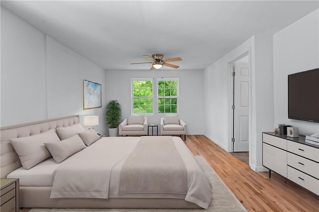 bedroom with a ceiling fan and light wood finished floors