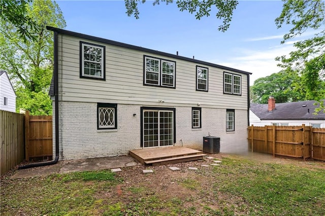 1322 Thurgood St SW, Atlanta, GA 30314 - rear view of property with brick siding, central AC, and a fenced backyard