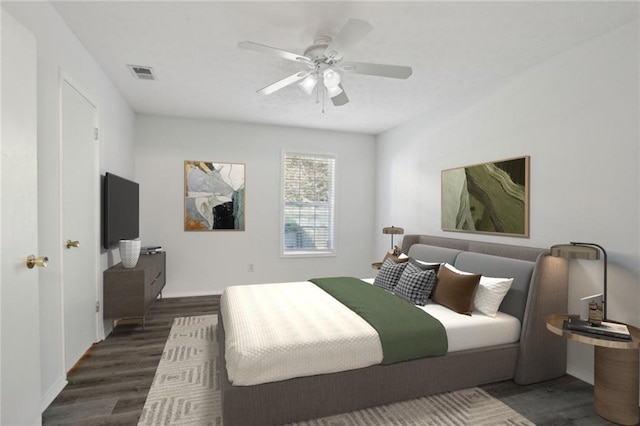 bedroom with dark hardwood / wood-style floors and ceiling fan