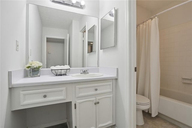 full bathroom with shower / bath combination with curtain, tile patterned floors, vanity, and toilet