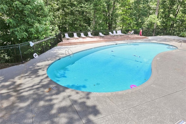 view of swimming pool with a patio