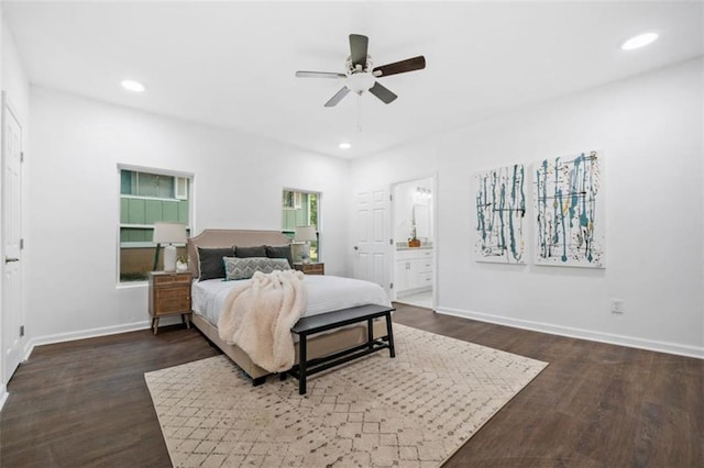 bedroom featuring recessed lighting, dark wood-style floors, baseboards, and ensuite bathroom