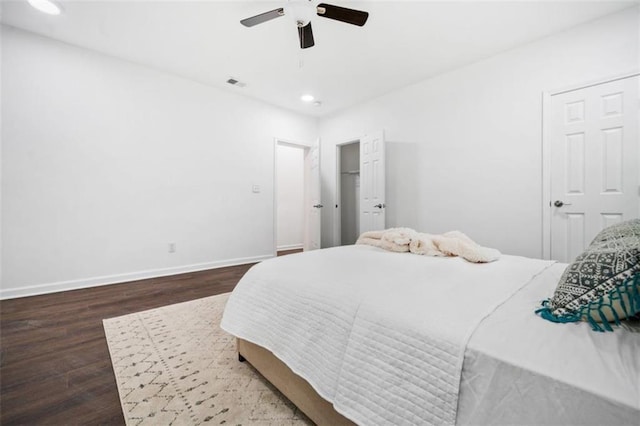 bedroom featuring visible vents, a ceiling fan, wood finished floors, recessed lighting, and baseboards