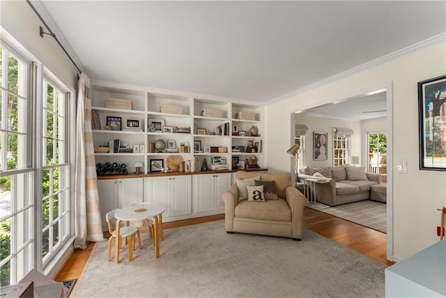 999 Seaboard Ave NW, Atlanta, GA 30318 - living area with light wood-type flooring, plenty of natural light, and crown molding