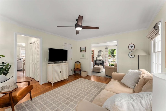 999 Seaboard Ave NW, Atlanta, GA 30318 - living room with ornamental molding, ceiling fan, and light wood-style floors