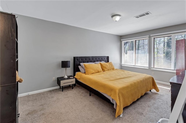 bedroom with visible vents, baseboards, and carpet floors