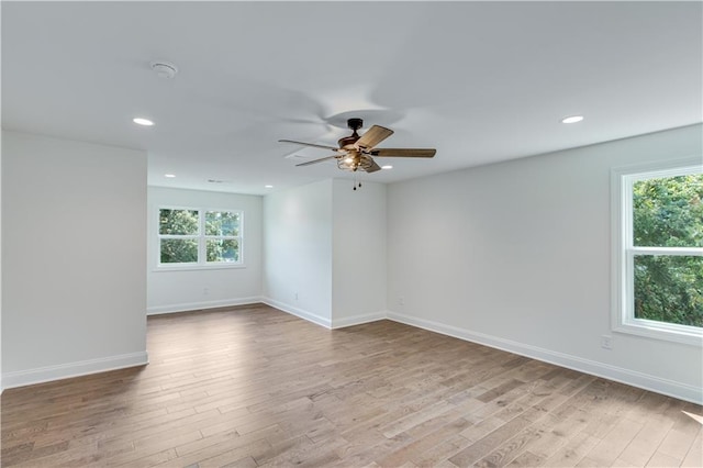 unfurnished room featuring ceiling fan and light hardwood / wood-style flooring