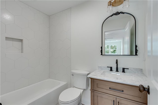 full bathroom featuring toilet, shower / washtub combination, vanity, and ceiling fan