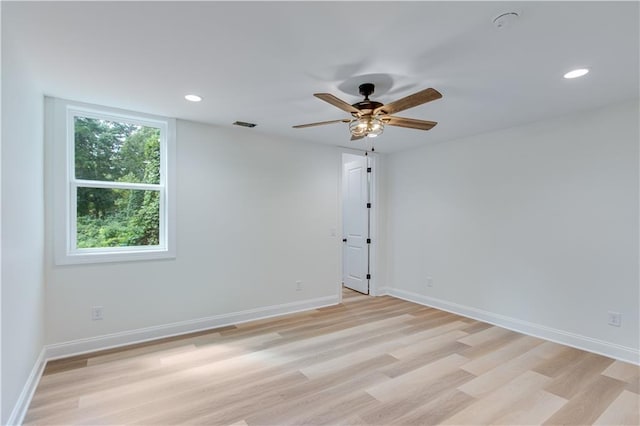 unfurnished room with ceiling fan and light hardwood / wood-style flooring