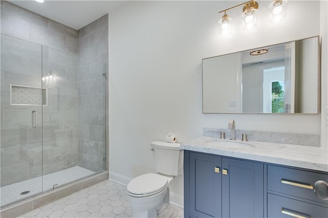 bathroom featuring a shower with door, tile patterned flooring, vanity, and toilet