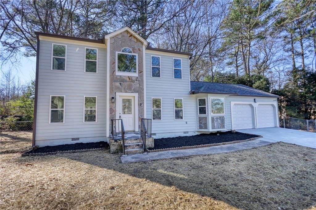 colonial home with a garage