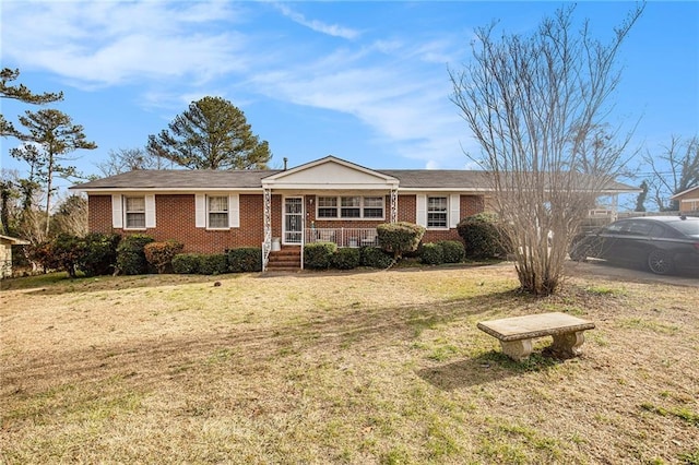 ranch-style home with a front lawn and a porch