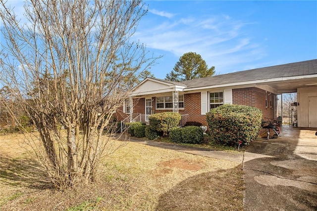 view of front of home with a carport