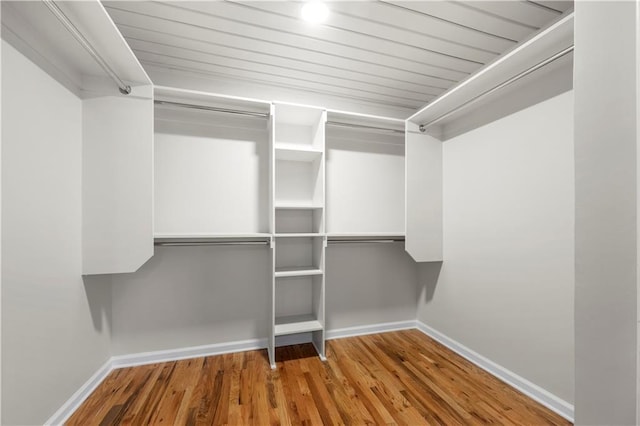 walk in closet featuring hardwood / wood-style flooring