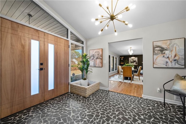 foyer with an inviting chandelier and french doors