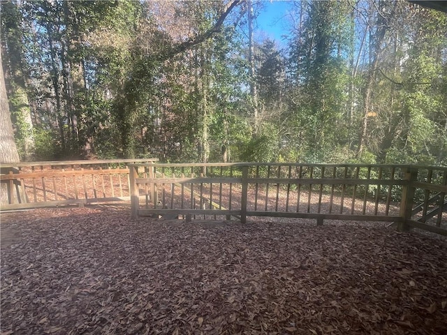 view of yard featuring a wooded view