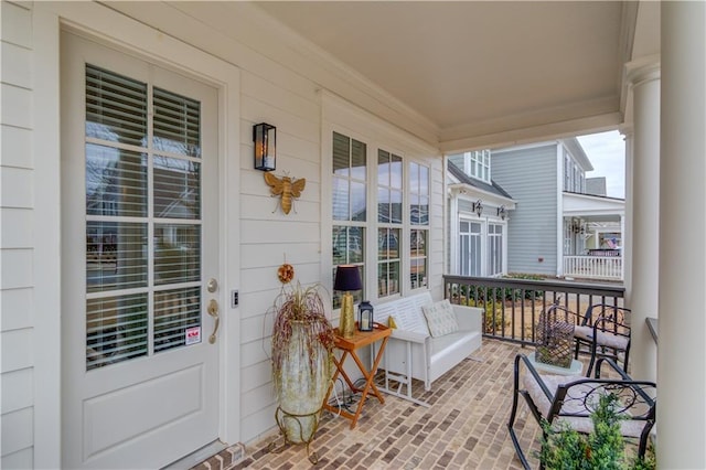 balcony featuring a porch