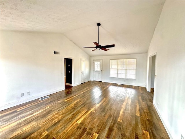 unfurnished room with ceiling fan, dark wood-type flooring, high vaulted ceiling, and a textured ceiling