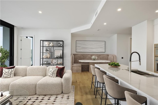 2425 Peachtree Rd NE Unit 903, Atlanta, GA 30305 - living area featuring recessed lighting and light wood-style flooring