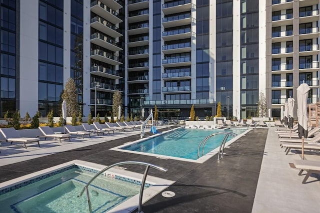 2425 Peachtree Rd NE Unit 903, Atlanta, GA 30305 - community pool featuring a hot tub and a patio