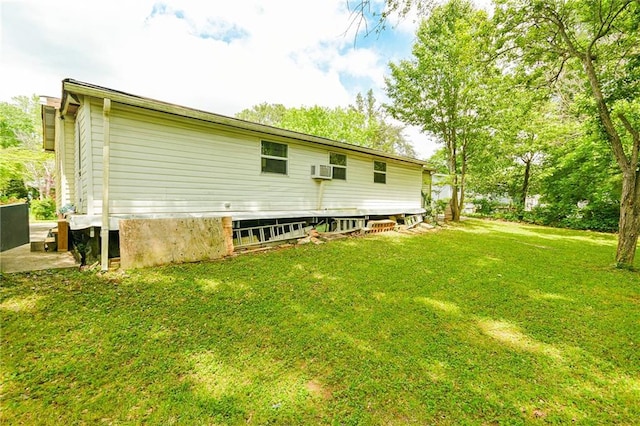 rear view of house with a lawn