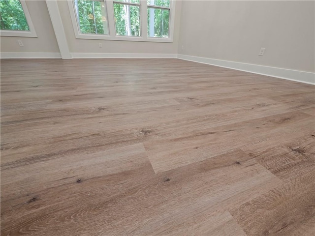 2335 Azalea Dr, Loganville, GA 30052 - spare room featuring plenty of natural light and wood finished floors