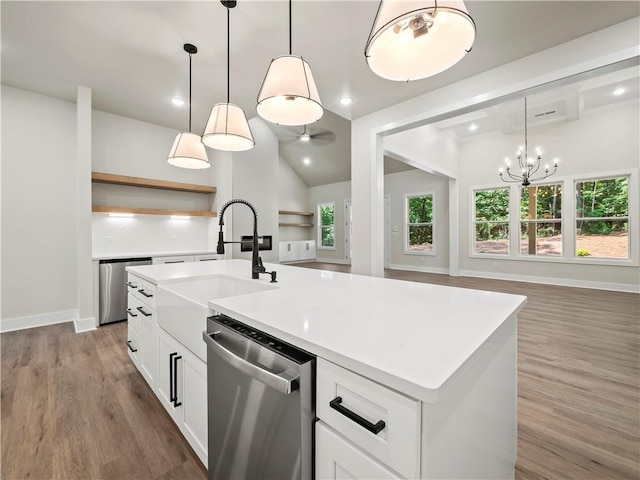 2335 Azalea Dr, Loganville, GA 30052 - kitchen with dishwasher, light wood-type flooring, open floor plan, white cabinets, and recessed lighting