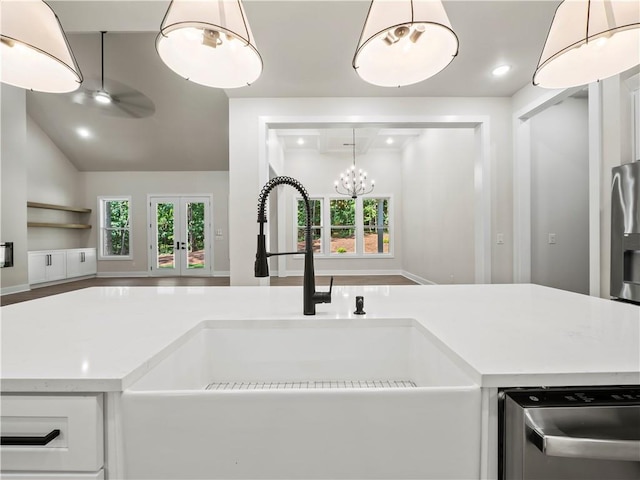 2335 Azalea Dr, Loganville, GA 30052 - kitchen with appliances with stainless steel finishes, plenty of natural light, a chandelier, open floor plan, and recessed lighting