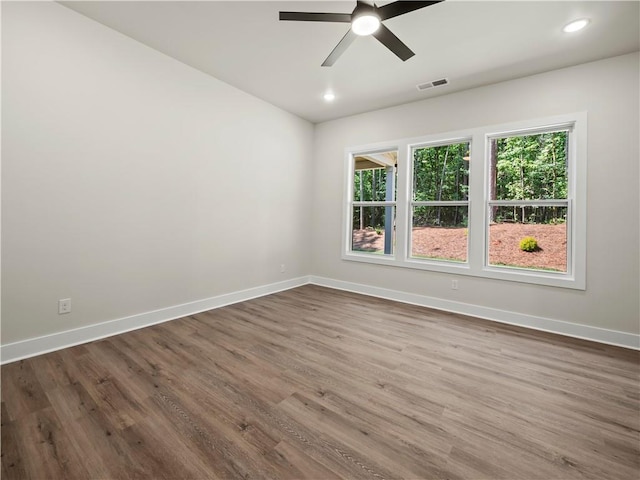 2335 Azalea Dr, Loganville, GA 30052 - empty room featuring ceiling fan, dark wood-style floors, and recessed lighting