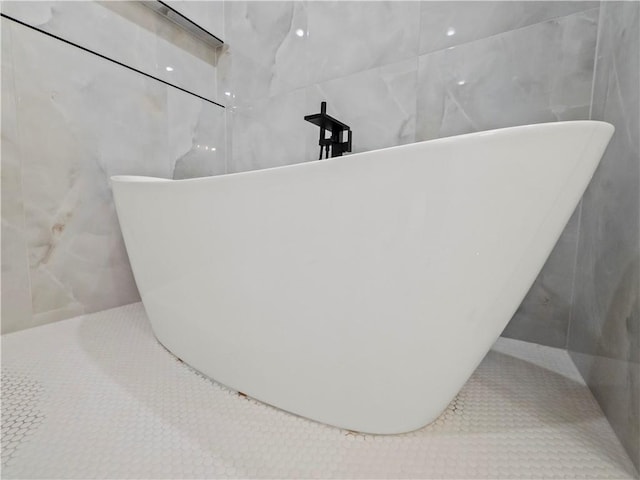 2335 Azalea Dr, Loganville, GA 30052 - bathroom view of tile walls and a freestanding bath