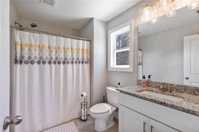 full bathroom featuring tile patterned flooring, visible vents, vanity, and toilet